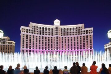 Bellagio hotel at night with fountains