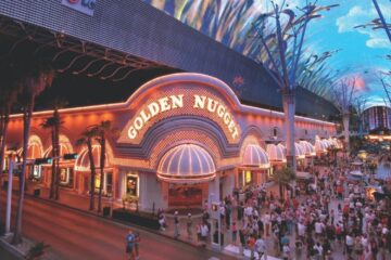 Entrance to the Golden Nugget Hotel and Casino at nighttime with a crowd lined up