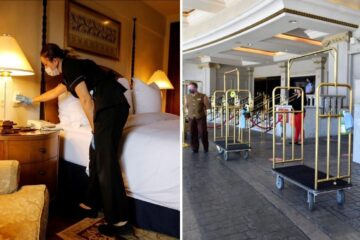 hotel employees wear face masks and clean rooms