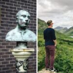 a statue in the republic of ireland, a man looks out over the hills of northern ireland