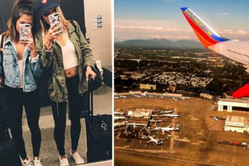 two girls take a selfie in an airport, the view of a southwest plane wing out of the plane window