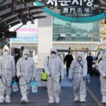 trained professionals clean the streets of south korea during the covid-19 pandemic