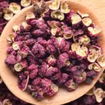 a spoonful of dried sichuan peppercorns