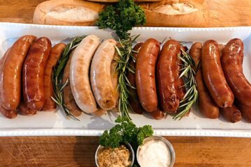 a plate full of german bratwurst