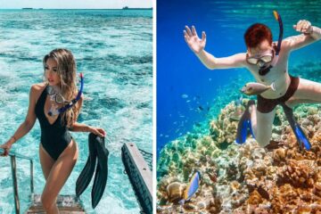 a woman walks up the boat stairs after snorkeling, a man snorkels near coral and watches tropical fish