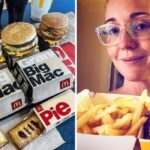 a full array of mcdonalds meals, a woman takes a selfie with mcdonalds food
