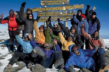 reaching the summit of mount kilimanjaro