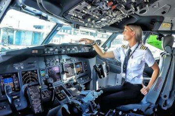 a pilot getting ready in the cockpit