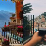 A view of the water and mountain from balcony in Italy/ vacationer holds up wine glass