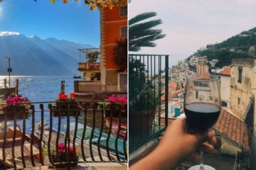 A view of the water and mountain from balcony in Italy/ vacationer holds up wine glass