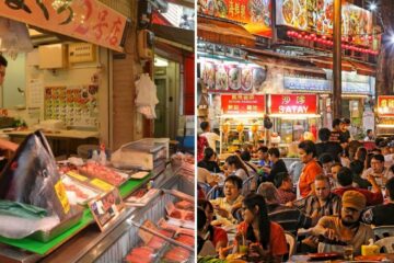 a fish monger cuts up a giant tuna, a crowded asian market