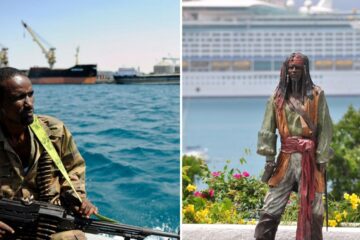 a modern day pirate sails out to a ship, a statue of jack sparrow