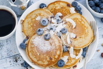 a stack of blueberry pancakes