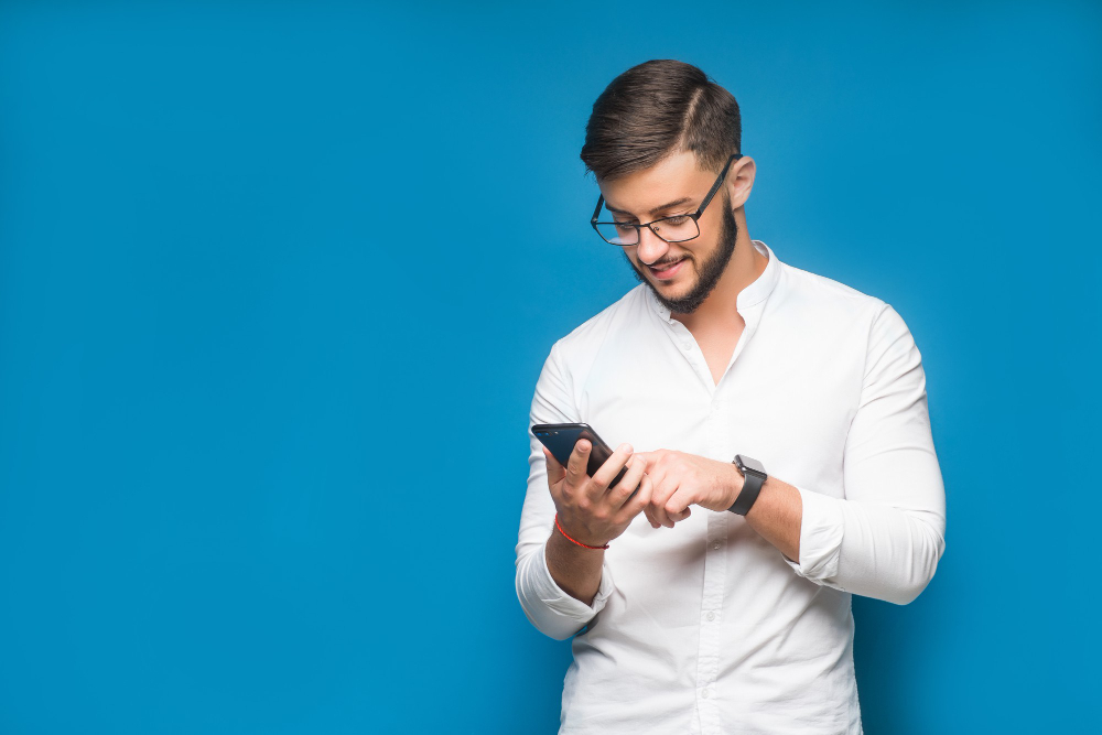 businessman using mobile phone app texting blue 1