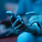 woman using her smartphone while home